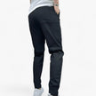Men's FJØRNA cargo pants with stretch fabric and multiple front and back pockets, designed for comfort and practicality.