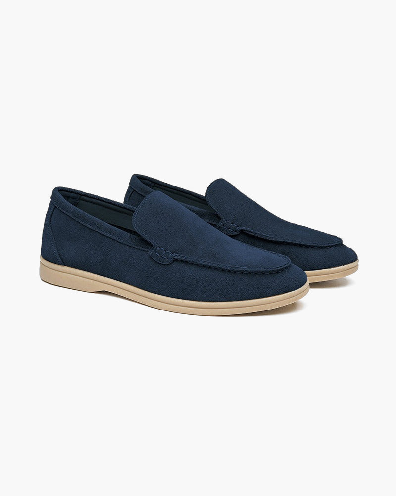FJØRNA men's classic suede slippers with fur lining, premium moccasin-style loafers for men, shown in dark brown with stitching details.