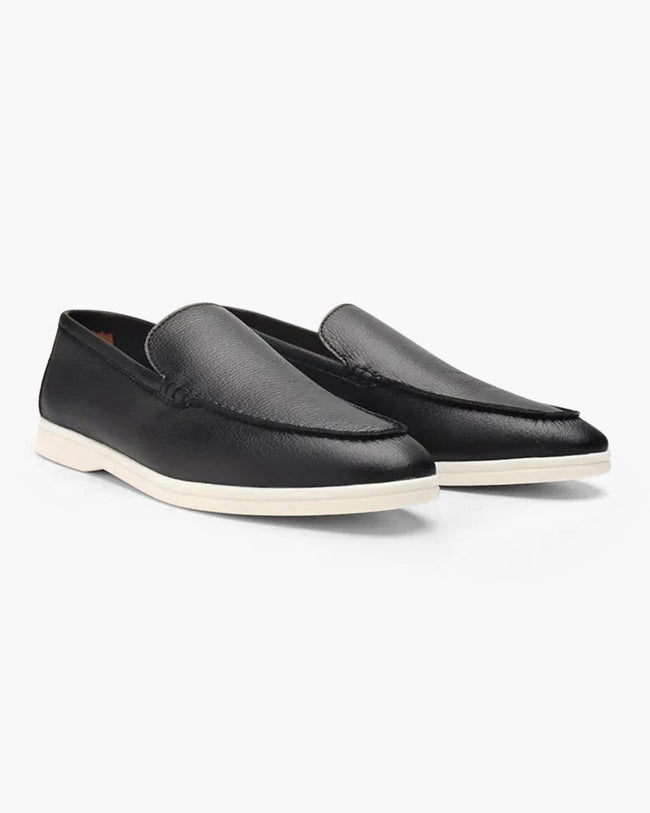 Men's elegant suede moccasin slippers by FJØRNA, featuring a sleek design and soft leather construction.