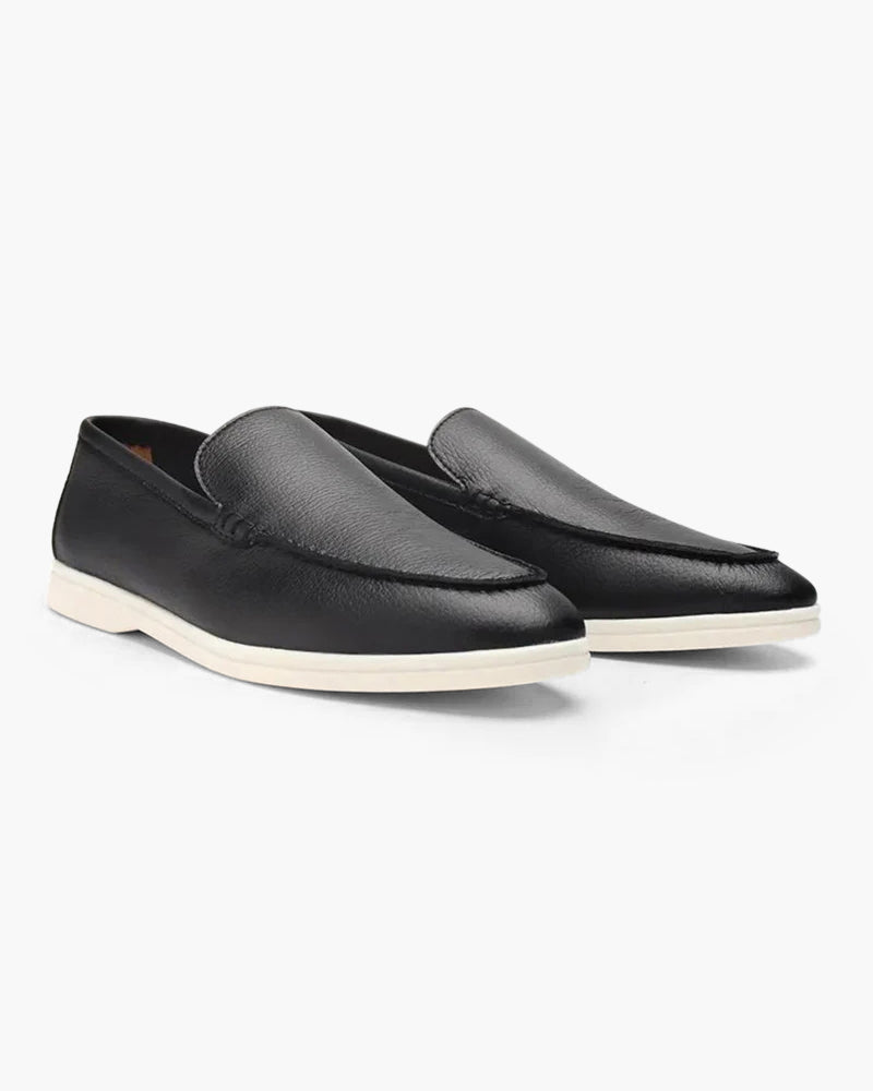 Men's elegant suede moccasin slippers by FJØRNA, featuring a sleek design and soft leather construction.