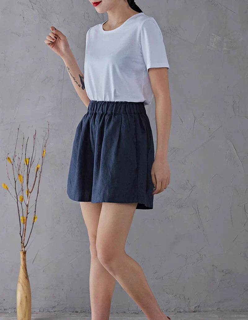 Women’s high waist linen blend shorts with elastic waistband, casual pants by FJØRNA, shown in a lightweight, breathable fabric style.