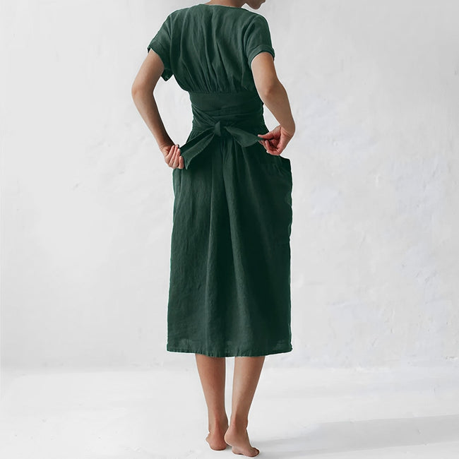 FJØRNA elegant women's midi dress with V-neck and short sleeves, stylish and suitable for casual or formal occasions.