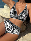 Women's floral V-neck bikini with high-waist shaping swimwear by FJØRNA, featuring a vibrant floral pattern and flattering fit.