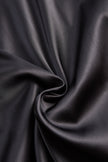 FJØRNA Glamorous Allure one-shoulder black maxi dress with flowing fabric and elegant drape, perfect for formal occasions.