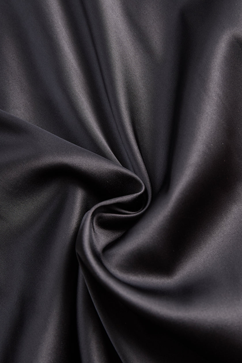 FJØRNA Glamorous Allure one-shoulder black maxi dress with flowing fabric and elegant drape, perfect for formal occasions.
