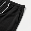 Men's linen short sleeve polo shirt and shorts set by FJØRNA, casual summer outfit, lightweight fabric, relaxed fit, neutral colors.