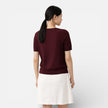 Women's knit top by FJØRNA featuring a wool blend, classic fit, and comfortable design, shown on a model.