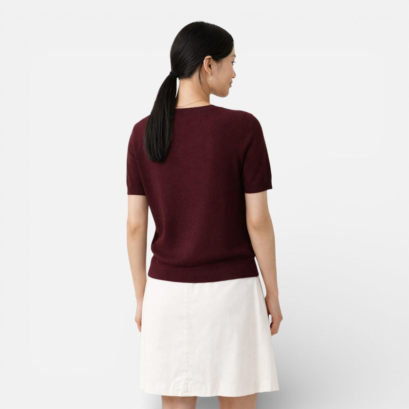 Women's knit top by FJØRNA featuring a wool blend, classic fit, and comfortable design, shown on a model.