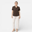 FJØRNA women's short sleeve button-up shirt, classic style, lightweight fabric, shown in a natural fit and casual design.