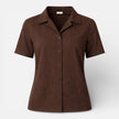FJØRNA women's short sleeve button-up shirt with a classic design, shown in a light fabric with a collar and front buttons.