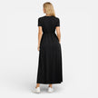 Women's maxi dress by FJØRNA featuring cotton fabric, classic short sleeves, and a comfortable, relaxed fit.