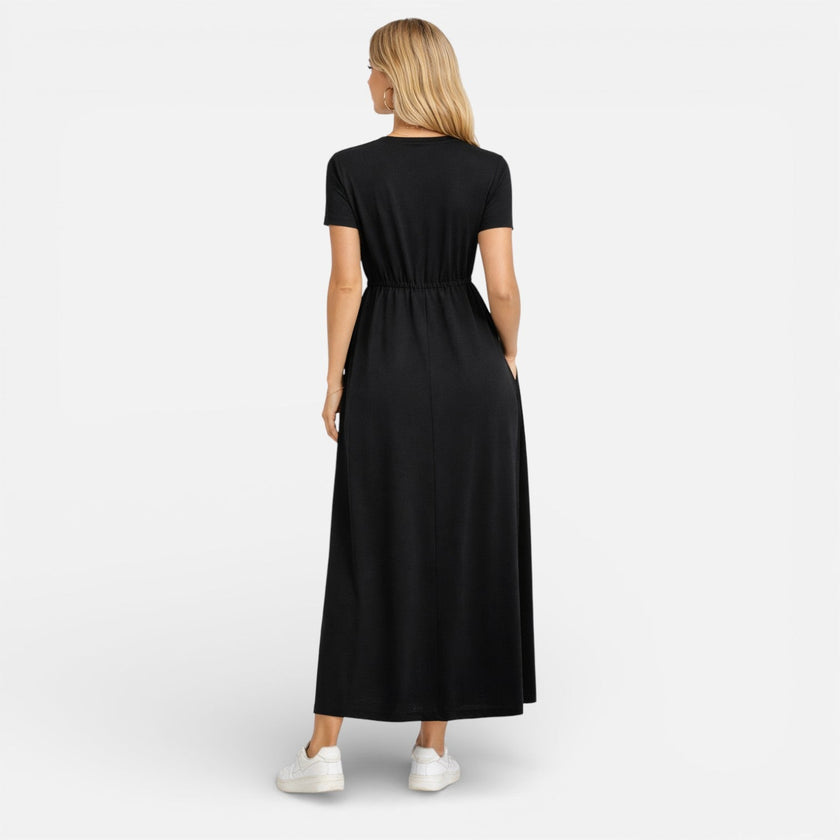 Women's maxi dress by FJØRNA featuring cotton fabric, classic short sleeves, and a comfortable, relaxed fit.