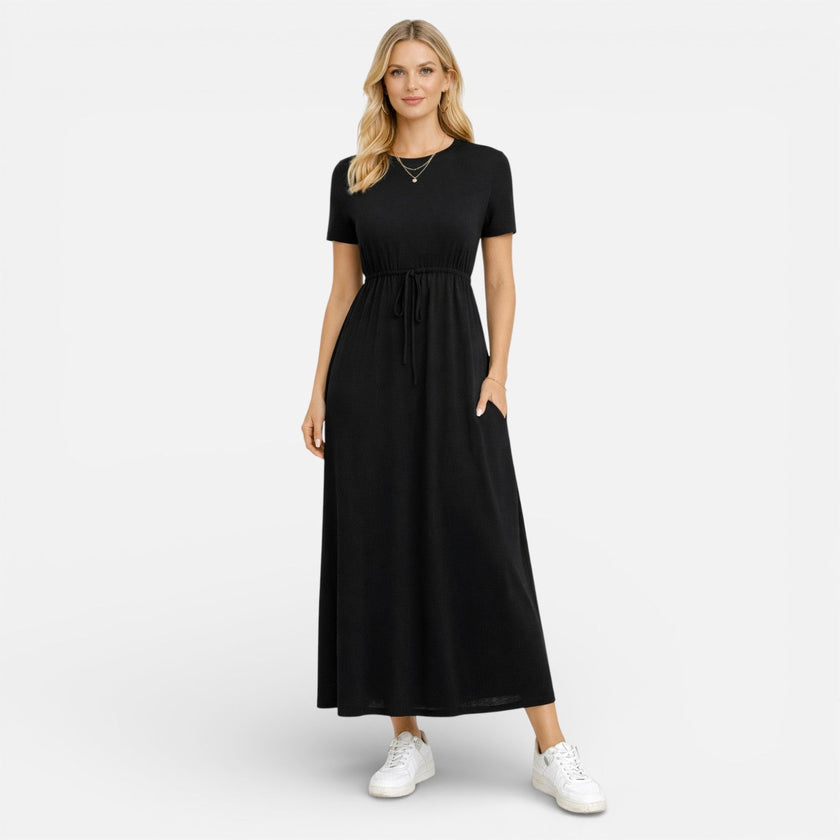Women's FJØRNA cotton maxi dress with short sleeves, comfortable and classic for casual wear, shown in a natural fabric and fit.