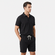 Men's linen short sleeve polo shirt and matching shorts set by FJØRNA, casual summer outfit with breathable fabric and stylish design.