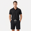 Men's linen short sleeve polo shirt and shorts set by FJØRNA, casual summer outfit with breathable fabric and stylish design.