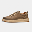 FJØRNA men's synthetic lace-up low top sneakers with sleek design and comfortable fit, shown from a side view.