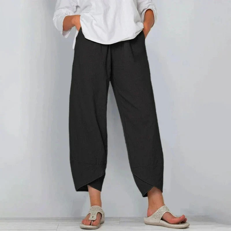 FJØRNA Tarni™ chic summer pants in lightweight fabric, featuring a relaxed fit and stylish design perfect for warm weather.