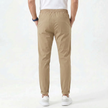 Men's stretchable comfort trousers by FJØRNA, showcasing the relaxed fit and durable fabric in a casual pose.