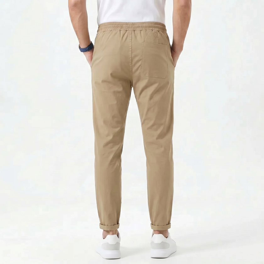 Men's stretchable comfort trousers by FJØRNA, showcasing the relaxed fit and durable fabric in a casual pose.