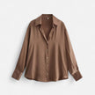 FJØRNA women's button-front long sleeve blouse in classic fit, featuring a tailored design and front buttons.