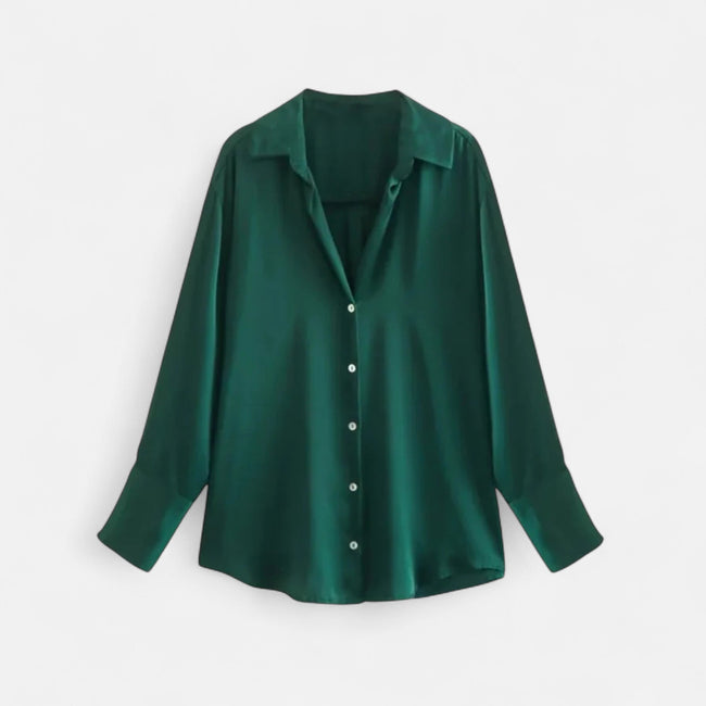 FJØRNA women's button-front long sleeve blouse in classic fit, featuring a smooth fabric and tailored design, shown on a hanger.