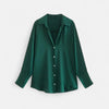 FJØRNA women's button-front long sleeve blouse in classic fit, featuring a smooth fabric and tailored design, shown on a hanger.