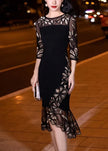 Black embroidered tulle patchwork fishtail dress by FJØRNA, featuring half sleeves and intricate embroidery details.