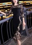 Black embroidered tulle patchwork fishtail dress by FJØRNA featuring half sleeves and intricate embroidery on a flowing silhouette.