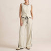 Ivory white FJØRNA two-piece set with contrast trim, featuring relaxed wide-leg pants and a matching top.