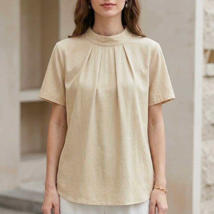 Ivory yellow summer blouse for women by FJØRNA featuring a high neck and short sleeves, casual and stylish top for warm weather.