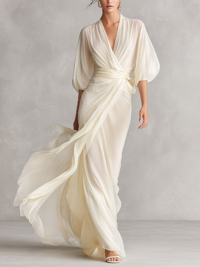 Ivory chiffon wrap dress for women by FJØRNA, flowing fabric with elegant drape, perfect for summer or special occasions.