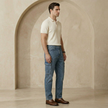 Light blue men's tapered jeans with elastic waistband and ankle cuffs from FJØRNA, casual and comfortable pants.