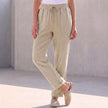 FJØRNA women's summer linen trousers with drawstring waist in khaki, casual and breathable for warm weather.