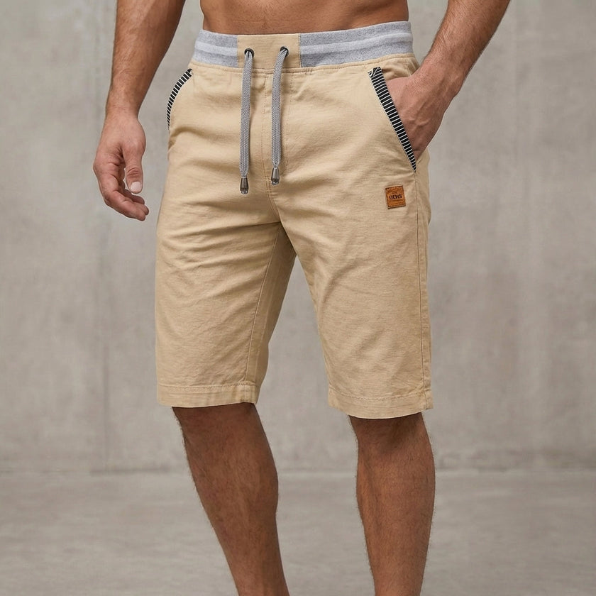 Men's FJØRNA relaxed-fit work shorts in khaki, tailored design with pockets and a casual, comfortable fit.