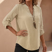 Khaki women's relaxed V-neck blouse with band collar and patch pocket, casual top by FJØRNA.