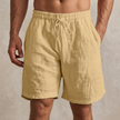 Men's khaki casual drawstring shorts with side pockets, FJØRNA brand, shown laid flat with pockets visible.