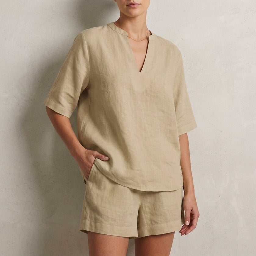 Khaki summer two-piece women's co-ord set by FJØRNA with V-neck top and pocket details, casual and stylish for warm weather.