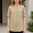 Khaki women's summer blouse by FJØRNA featuring puff sleeves and a button-front denim design.