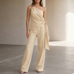 Khaki summer two-piece women's co-ord set by FJØRNA with pockets and one-shoulder design, perfect for warm weather.