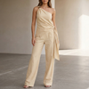 Khaki summer two-piece women's co-ord set by FJØRNA with pockets and one-shoulder design, perfect for warm weather.