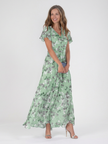 FJØRNA women's summer maxi dress with floral pattern and flutter sleeves, flowing fabric perfect for warm weather.