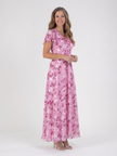 Floral summer maxi dress for women with flutter sleeves by FJØRNA, featuring a flowy, elegant design and vibrant floral pattern.