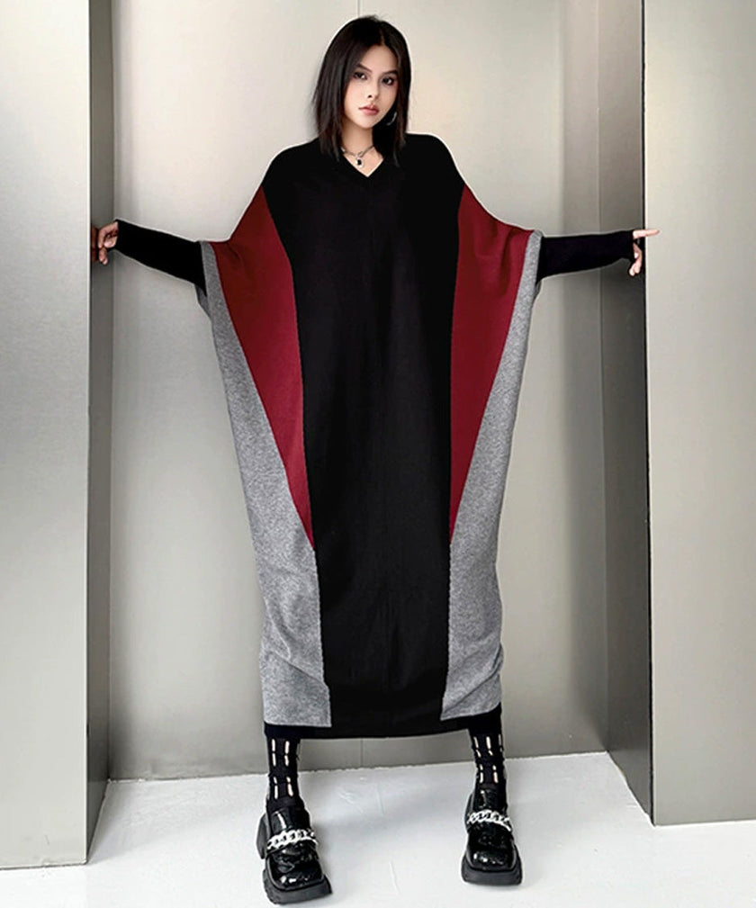 FJØRNA white panel knit long dress displayed on a hanger, featuring a fitted silhouette and textured knit fabric.