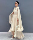 White Veil Flow Dress by FJØRNA, featuring a flowing silhouette and elegant design, displayed on a neutral background.