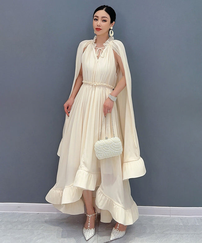 White Veil Flow Dress by FJØRNA featuring a flowing fabric and elegant design, displayed on a mannequin.
