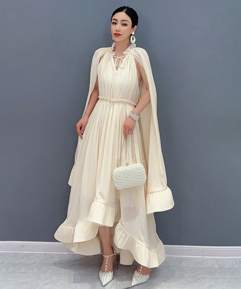 White Veil Flow Dress by FJØRNA featuring a flowing fabric and elegant design, displayed on a mannequin.