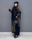 White floral motif knit long dress by FJØRNA featuring a fitted bodice and flowing skirt with intricate floral patterns.