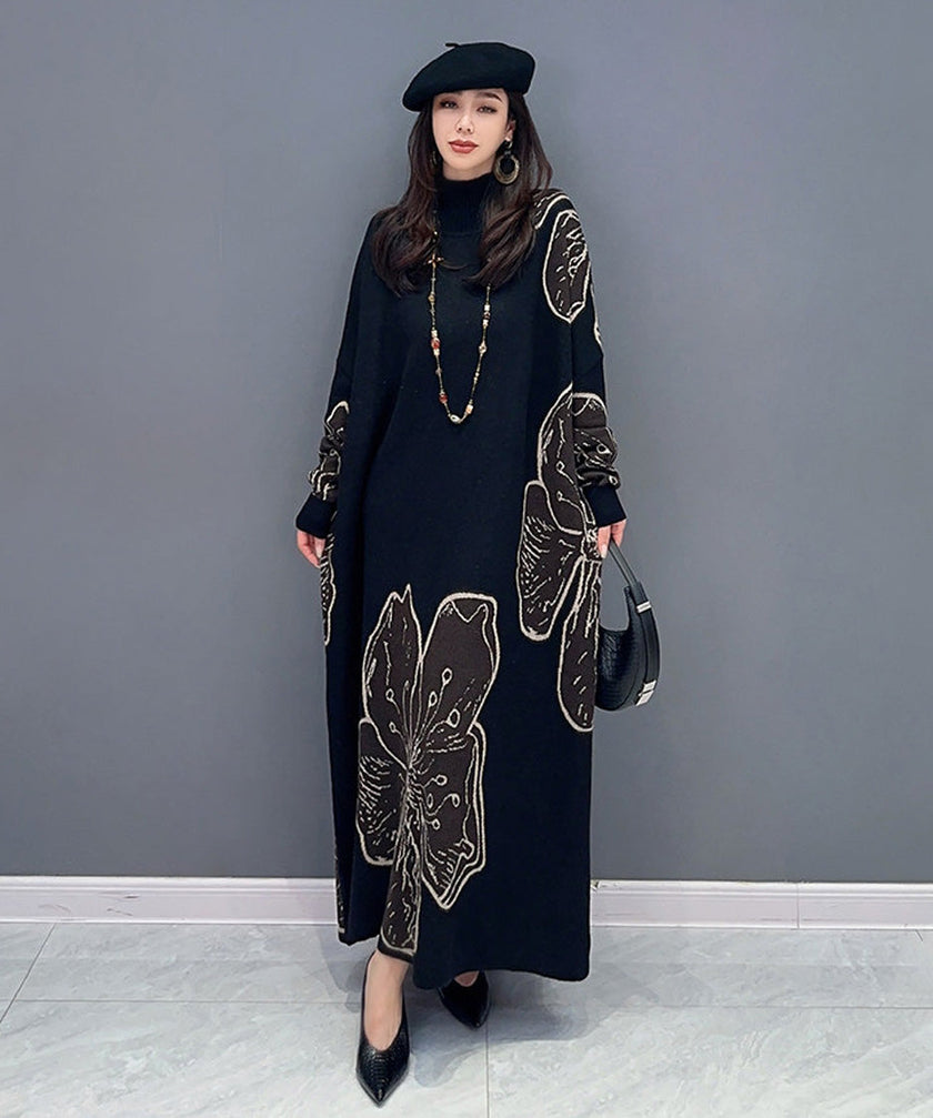 White floral motif knit long dress by FJØRNA with a flowing silhouette and intricate floral patterns.