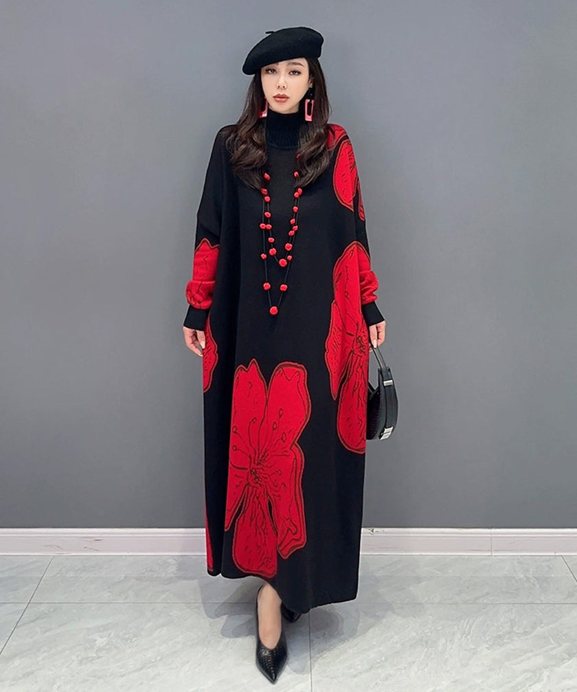 White FJØRNA floral motif knit long dress with a flowing silhouette and intricate flower patterns on soft fabric.