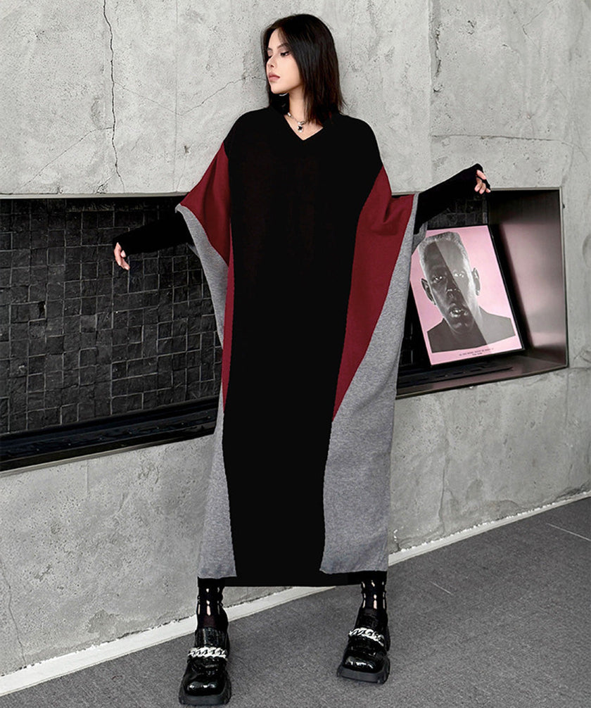 White FJØRNA Panel Knit Long Dress hanging on a mannequin with a fitted silhouette and long sleeves.